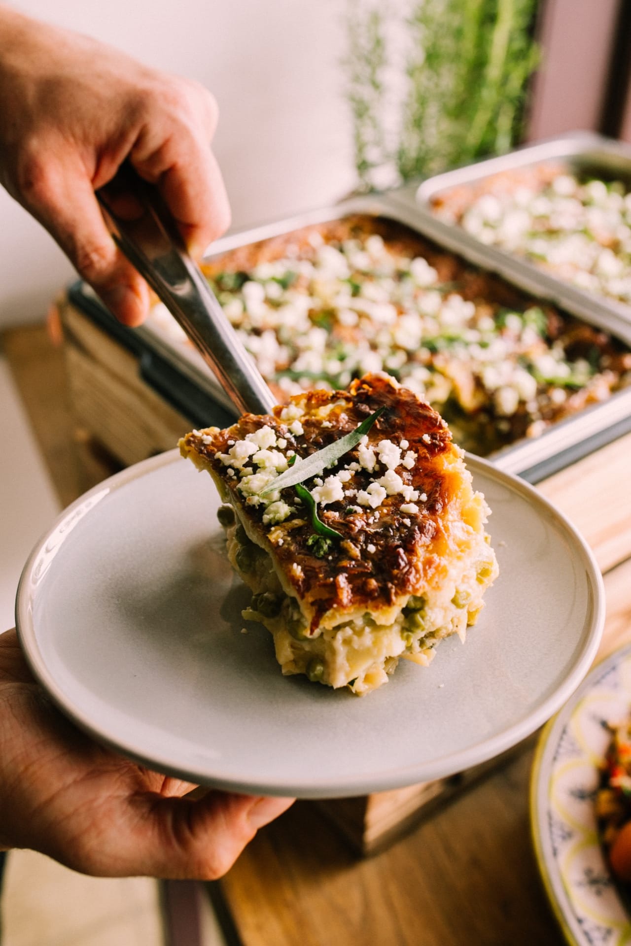 A DIS chef serving up a fresh, handmade dish in their own kitchen